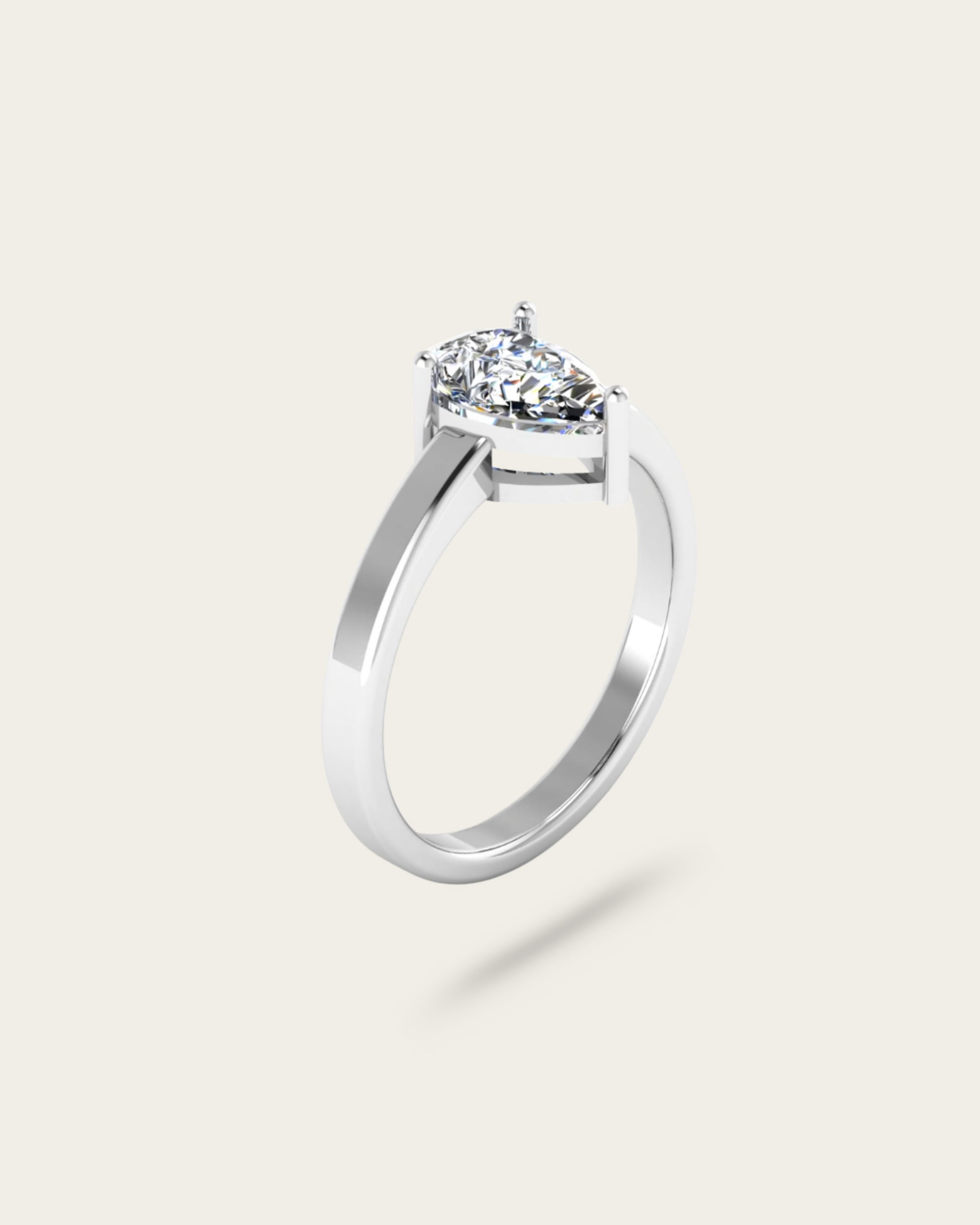 Pear Cut Solitaire Style Engagement Ring