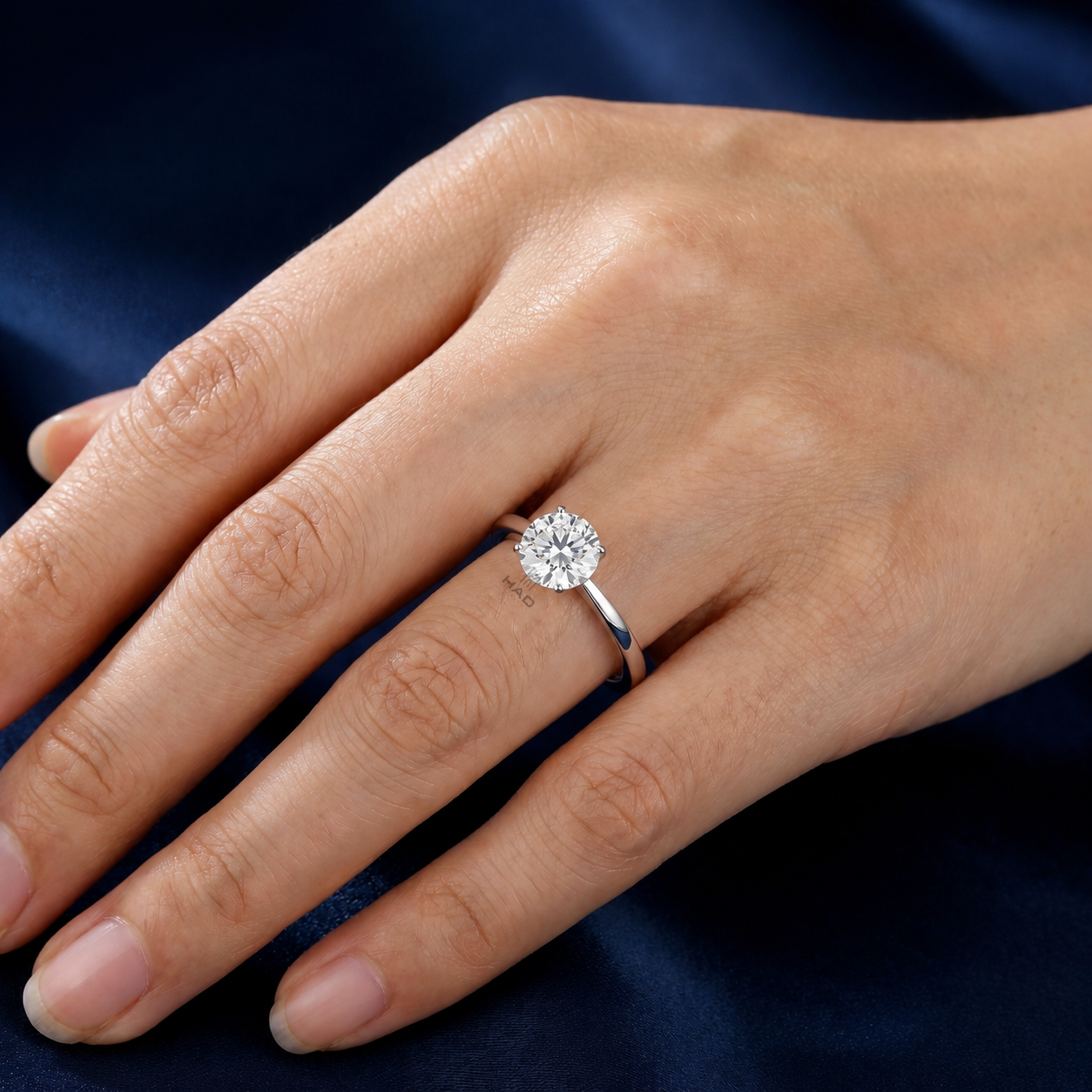 Round Cut Solitaire Style Engagement Ring