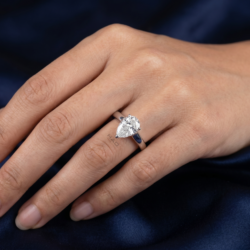 Pear Cut Solitaire Style Engagement Ring