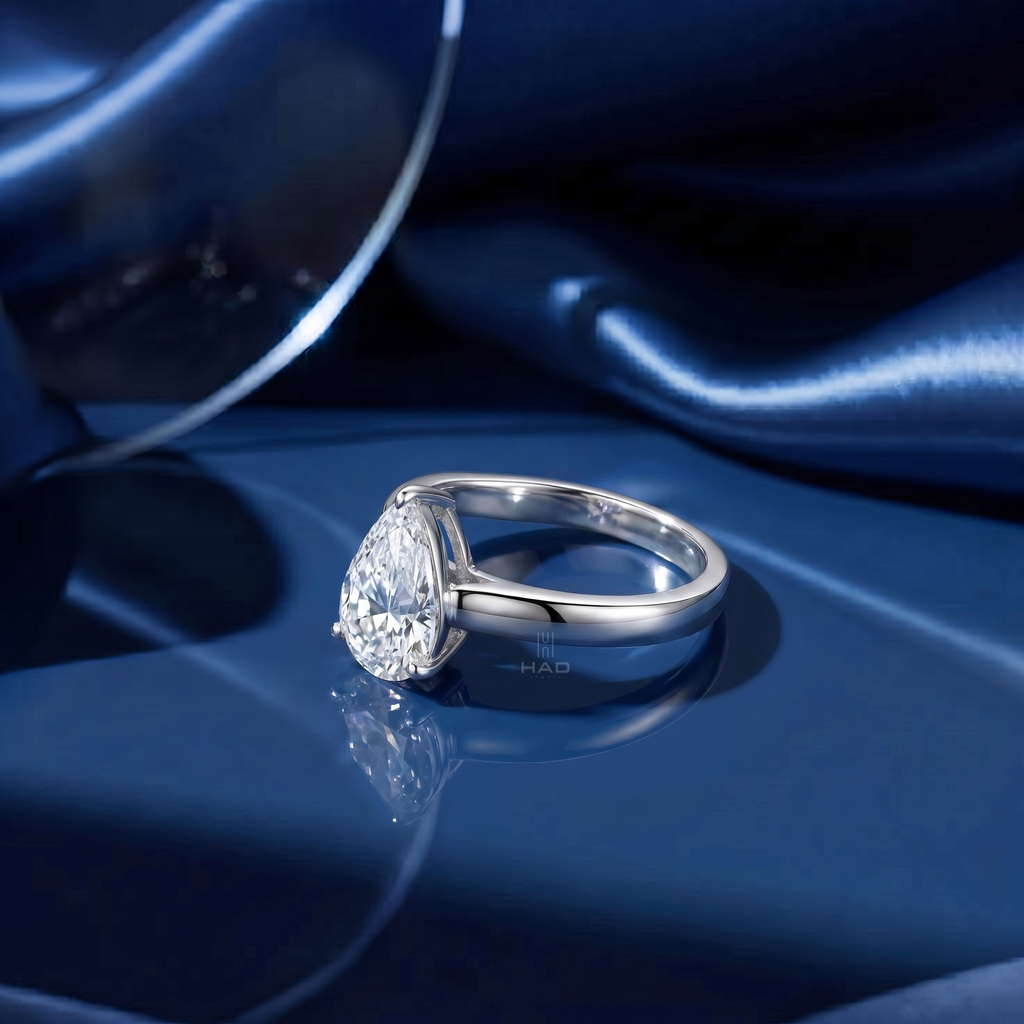 Pear Cut Solitaire Style Engagement Ring