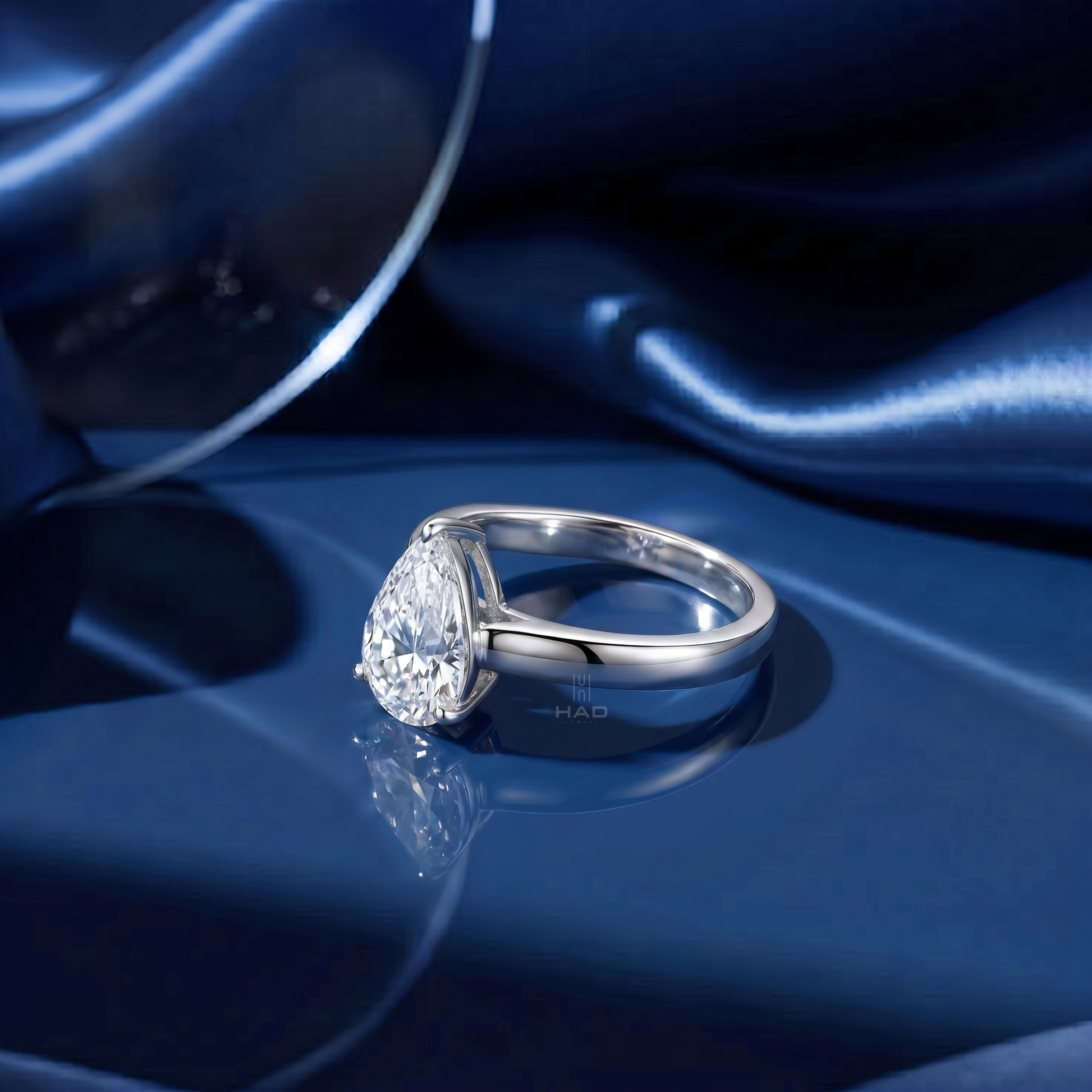 Pear Cut Solitaire Style Engagement Ring